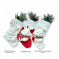 Load image into Gallery viewer, Christmas stocking bunny character with white or colored knitted scarf, looking like half a toy, on a white or red plush stocking with a white cuff.