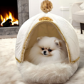 Load image into Gallery viewer, A small beige pet cave bed with a removable dome and a removable waterproof cotton cushion, shown with a white dog peeking out from the opening.