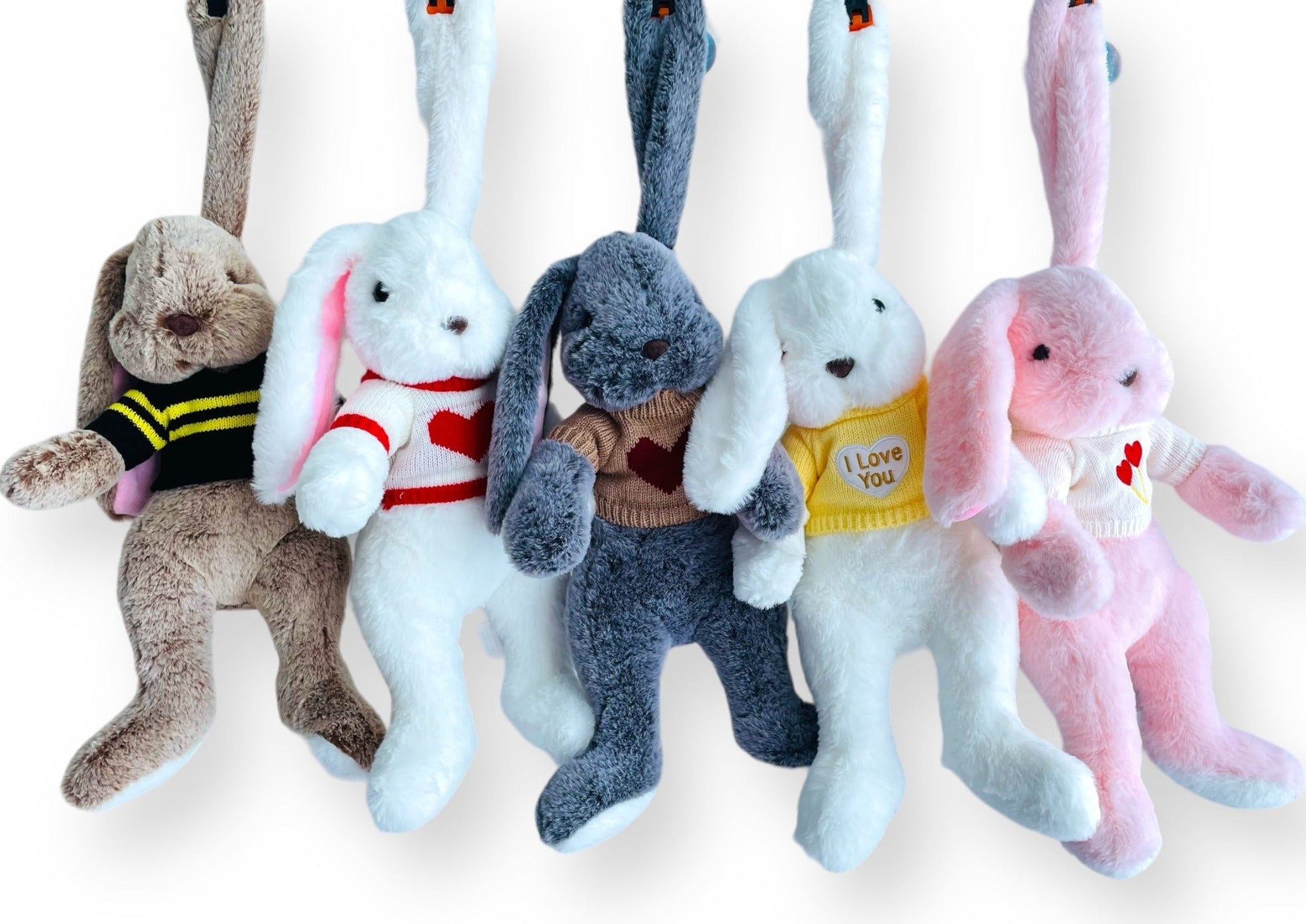 Cuddly bunny toy for kids wearing a removable sweater in 5 color combinations