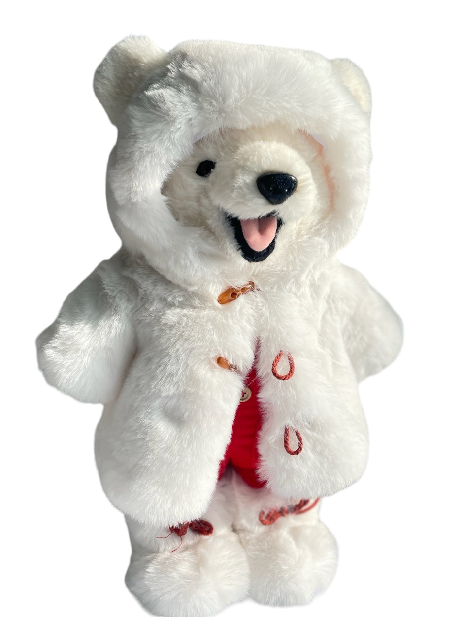 A large polar bear stuffed animal dressed in a removable fur coat, boots and red overalls with a 3D laughing mouth where you can even see his tongue, plastic nose and eyes.